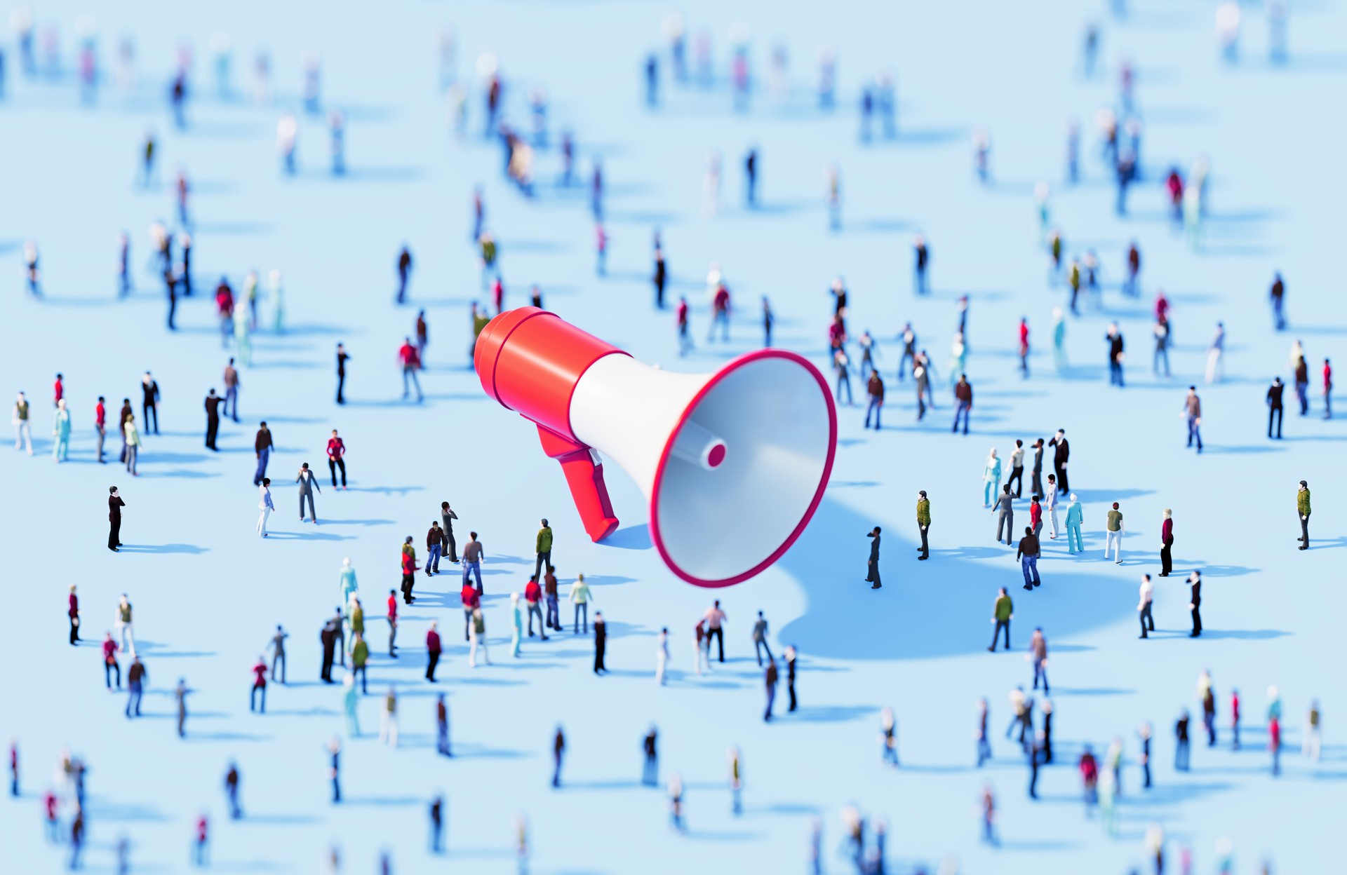 Human Crowd Surrounding Red Megaphone Object On Blue Background